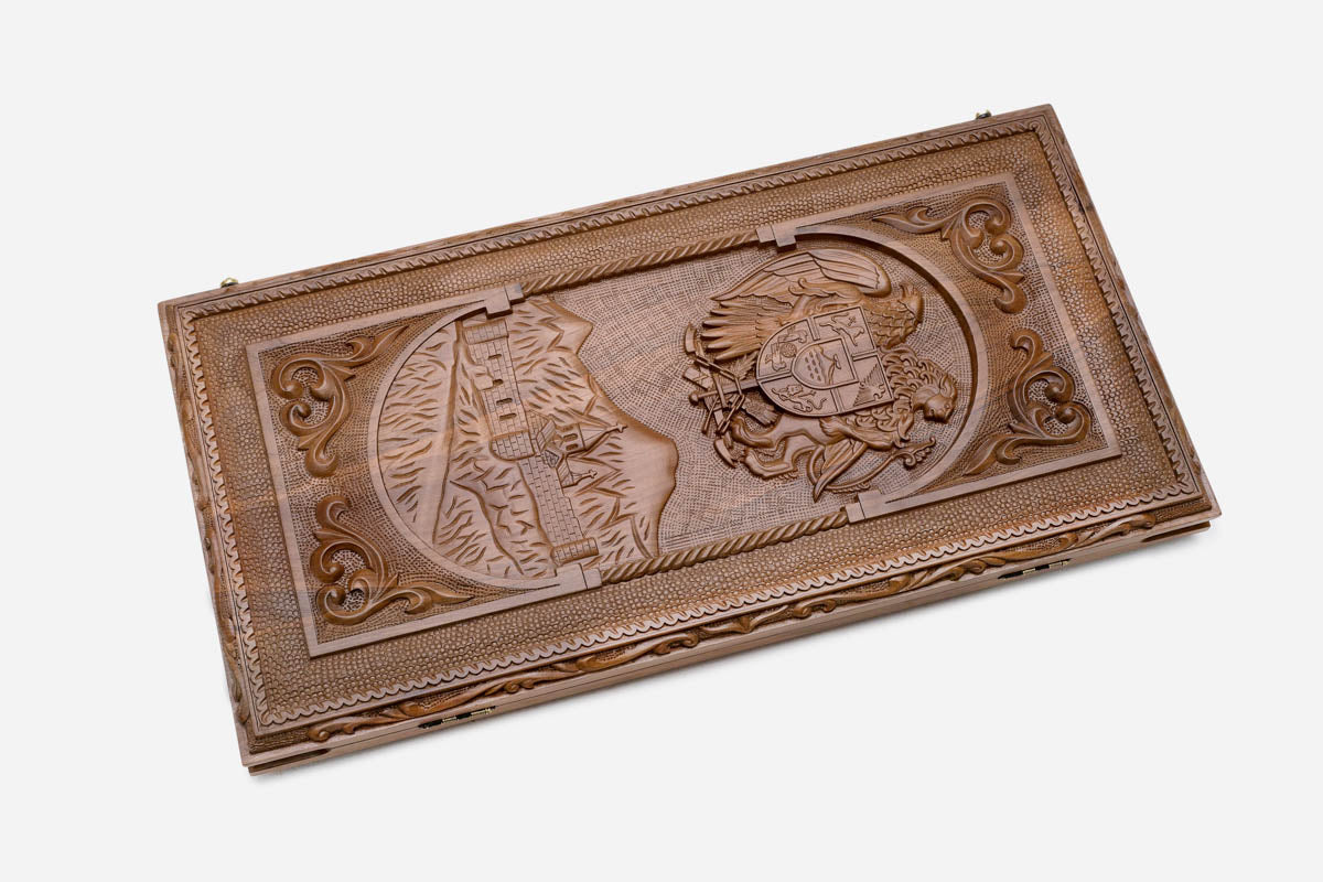 Angled view of the Armenian alphabet carved backgammon board