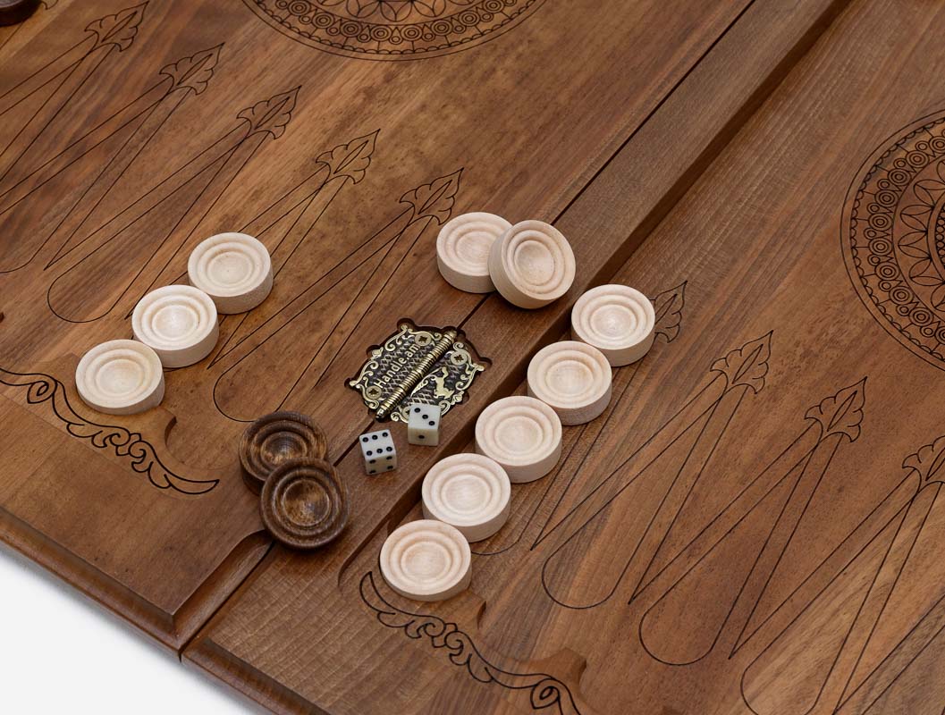 Close-up of the deep walnut carving