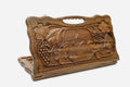 Carved walnut backgammon board with the Geghard Monastery and a carry handle, propped open