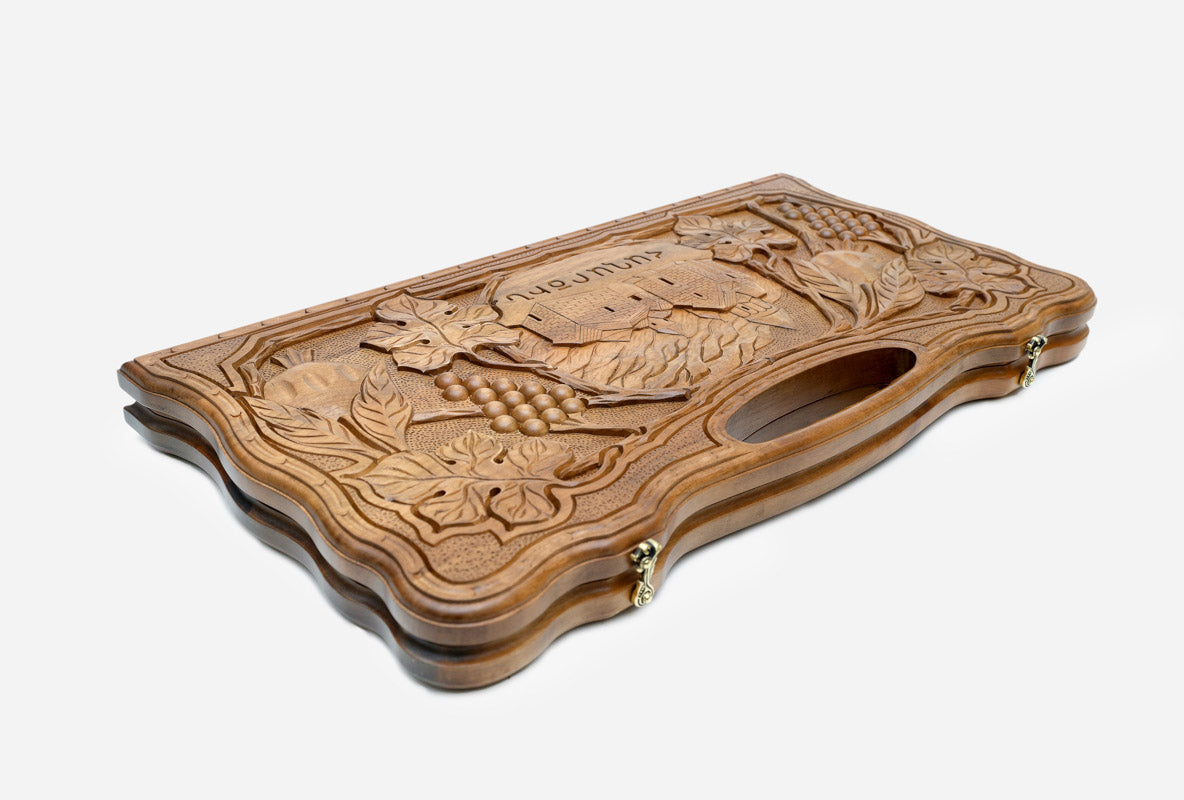 The backgammon board opened to show the wooden playing surface