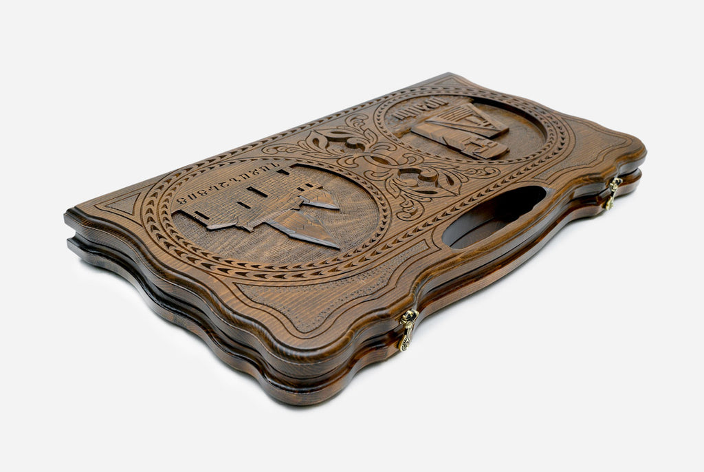 The backgammon board opened to show the wooden playing surface