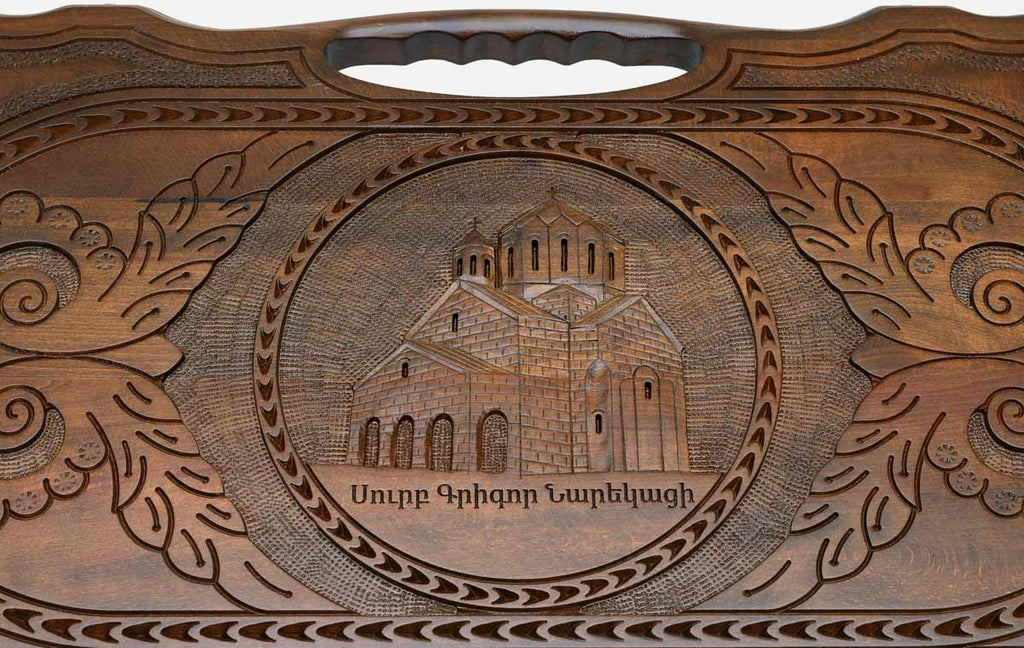 The backgammon board opened to show the wooden playing surface