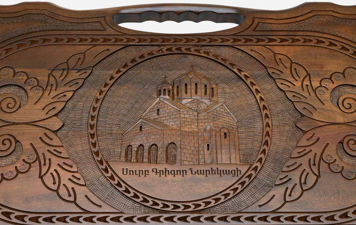 The backgammon board opened to show the wooden playing surface