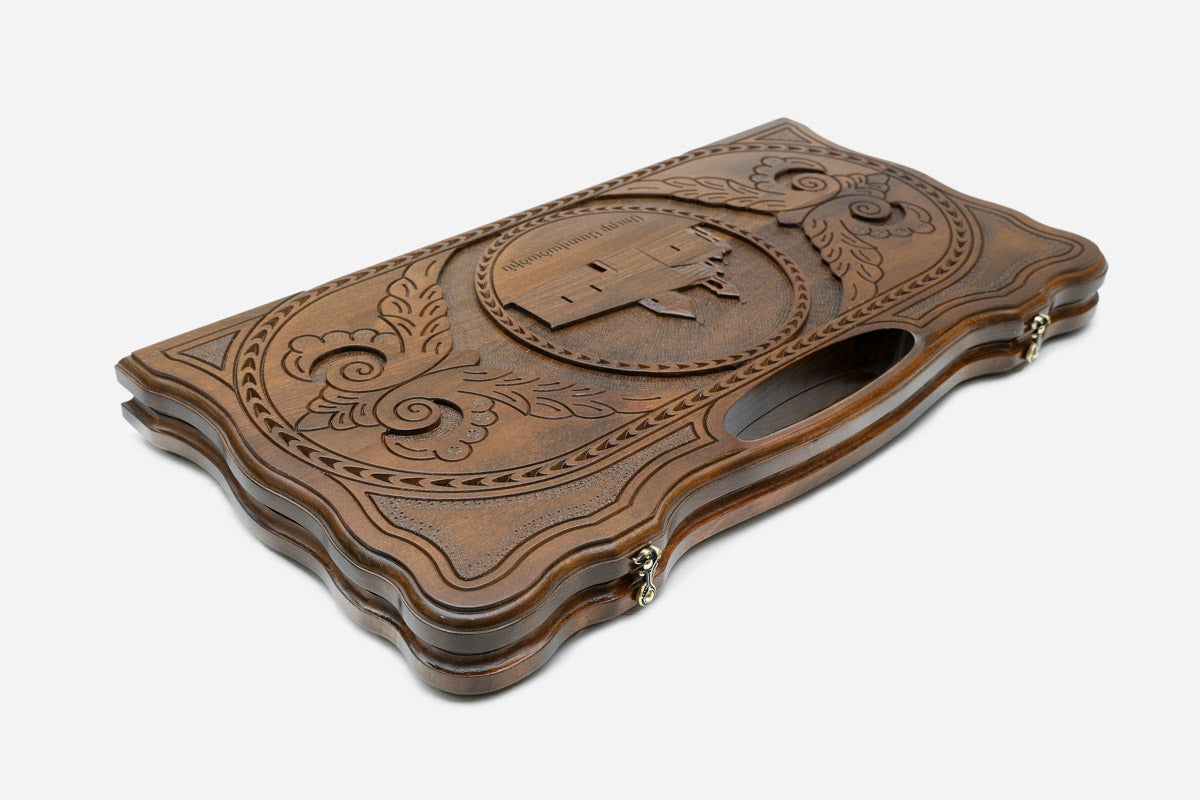 The backgammon board opened to show the wooden playing surface