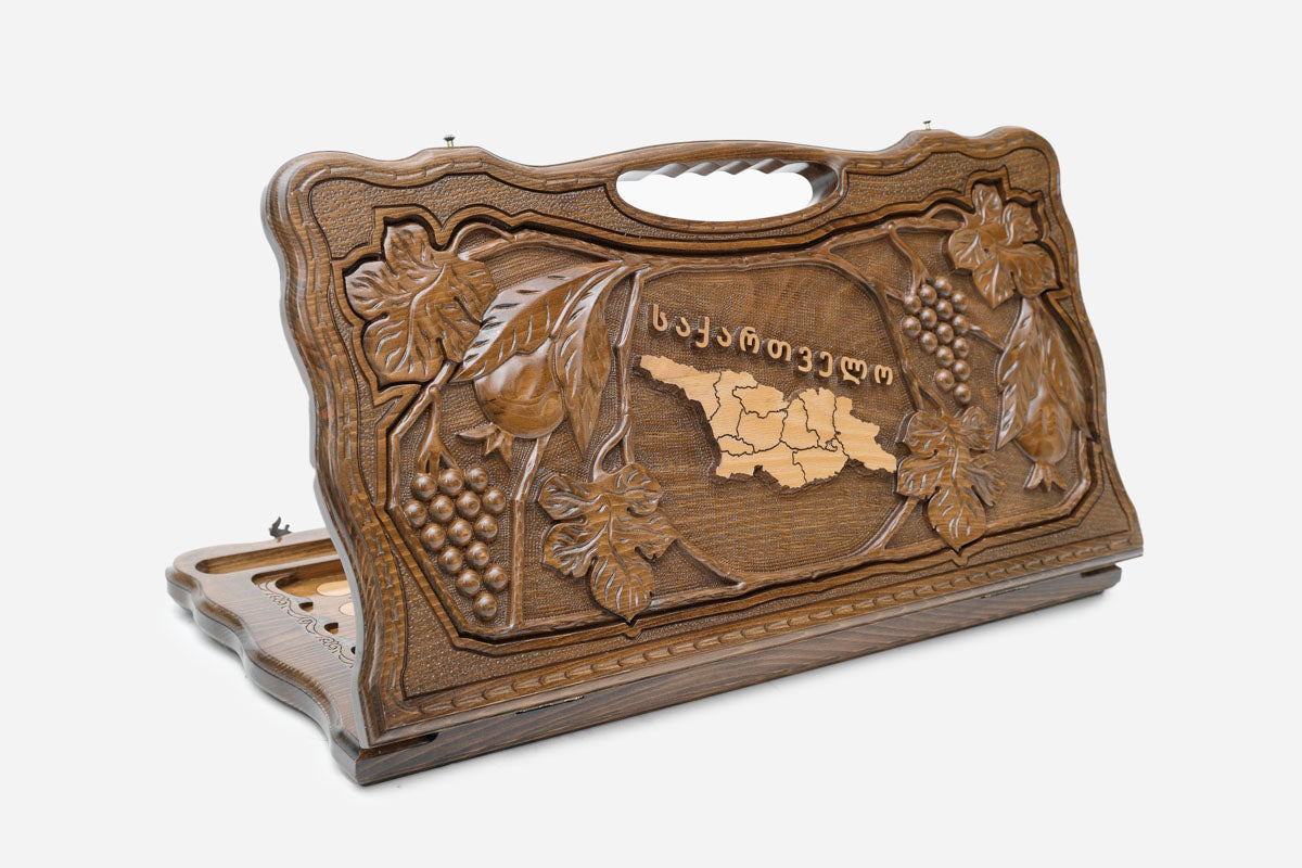 Carved beechwood backgammon board with the map of Georgia framed by grapevines and flowers, with a carry handle, propped open