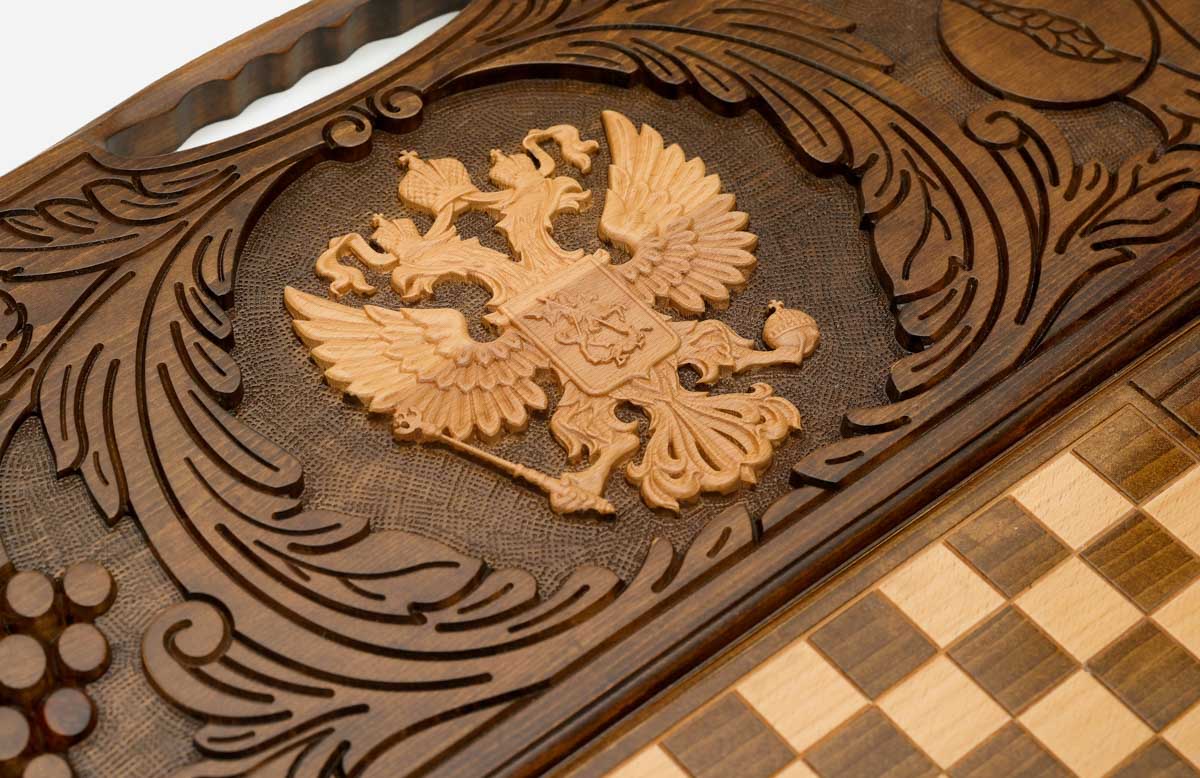 The backgammon board opened to show the wooden playing surface