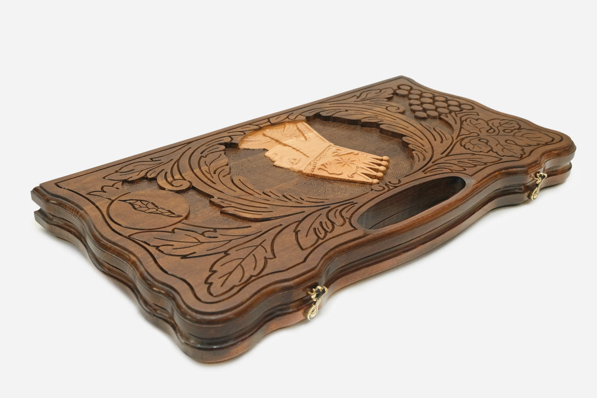 The backgammon board opened to show the wooden playing surface