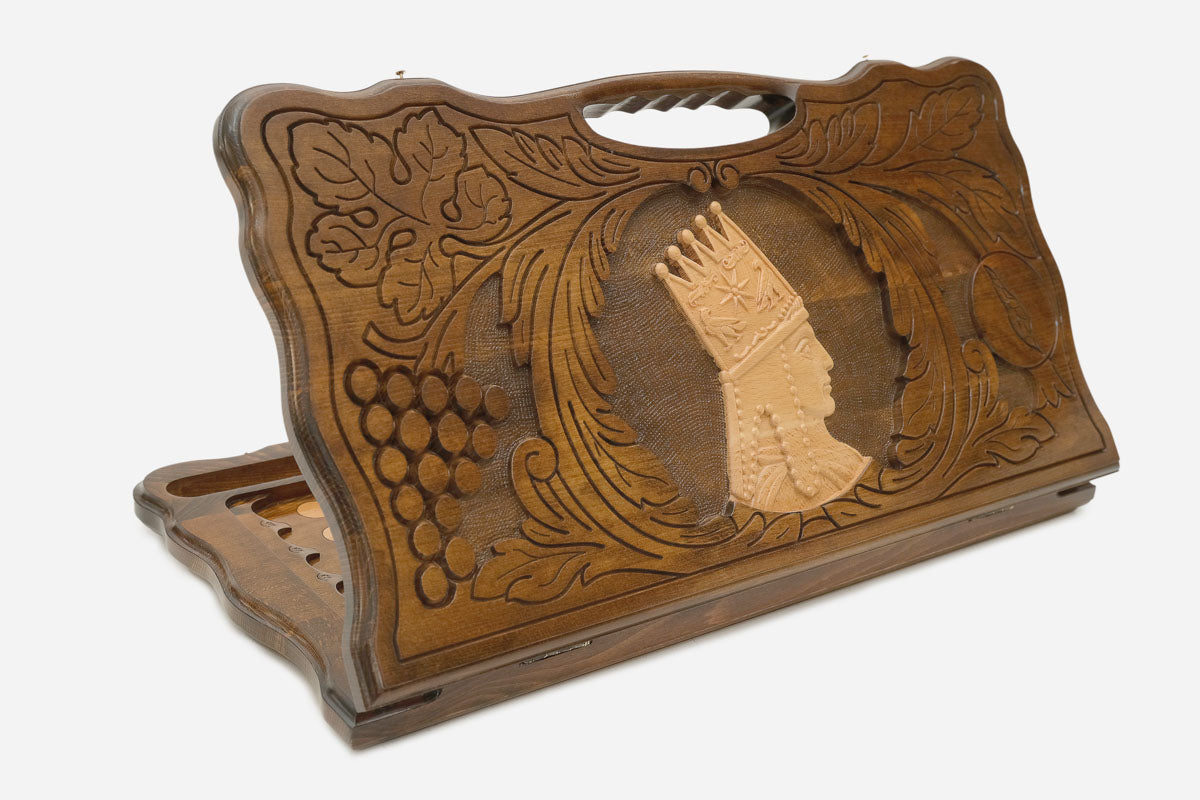 Carved beechwood backgammon board with a portrait of Tigran the Great and a carry handle, shown propped open