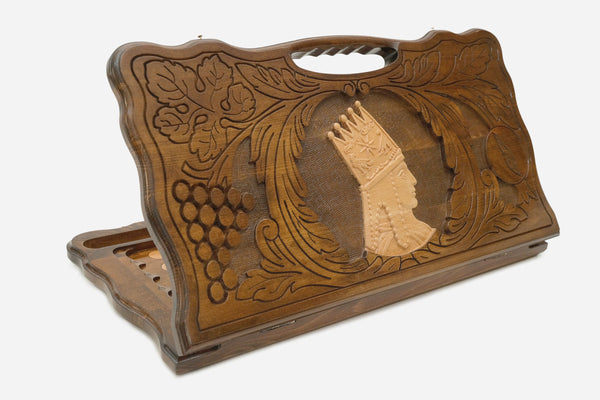 Carved beechwood backgammon board with a portrait of Tigran the Great and a carry handle, shown propped open