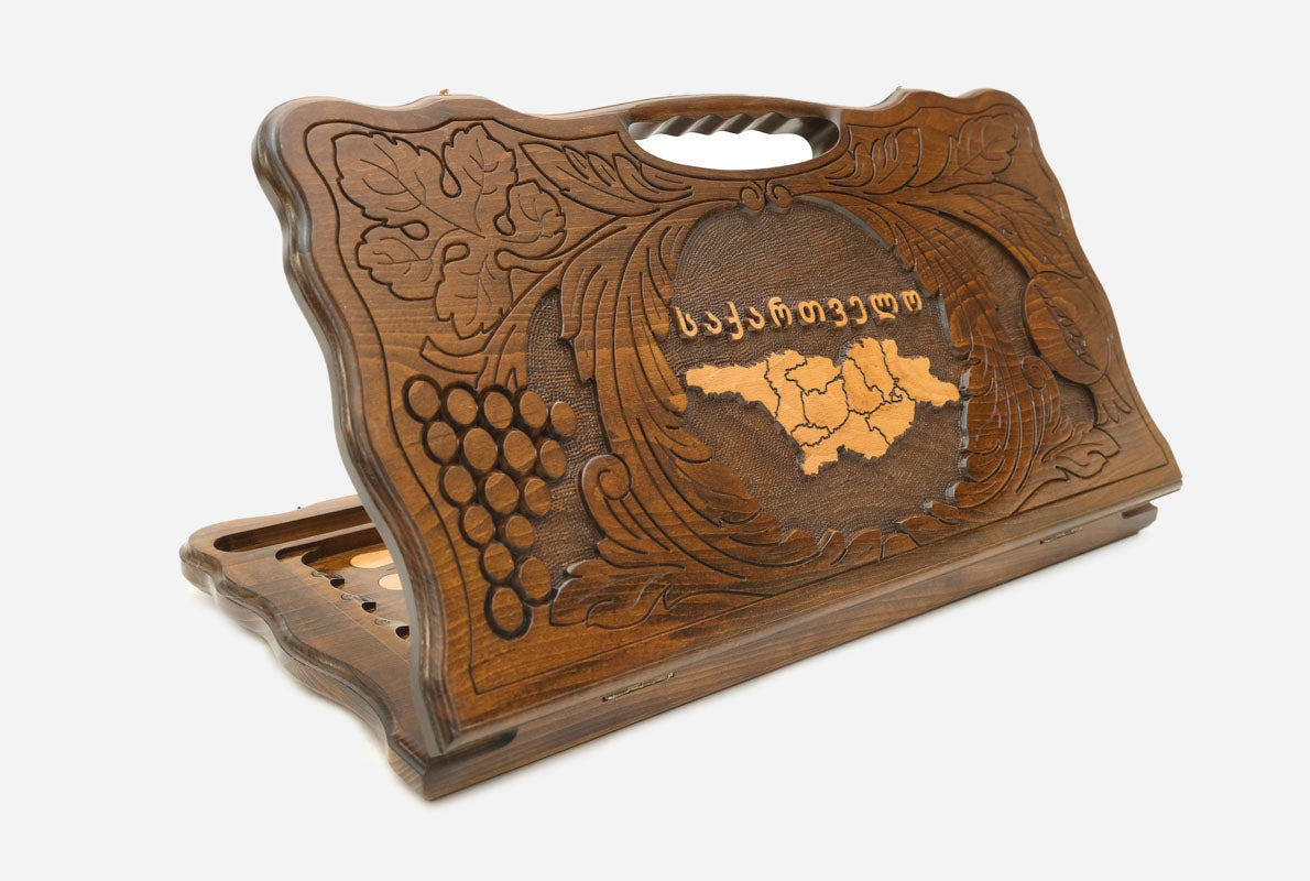 Carved beechwood backgammon board with the map of Georgia and a carry handle, shown propped open
