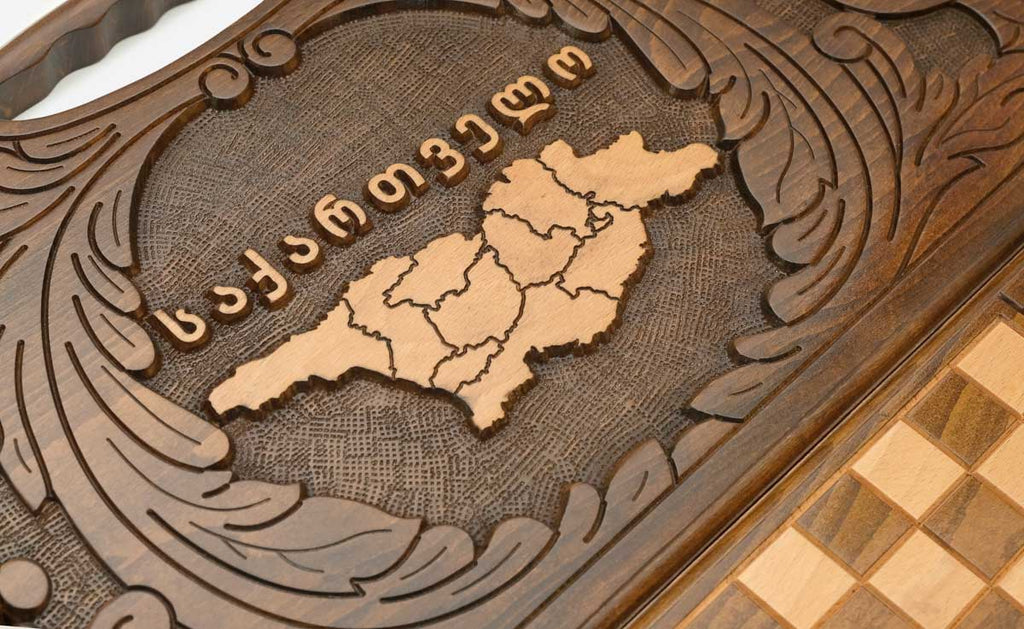 The backgammon board opened to show the wooden playing surface