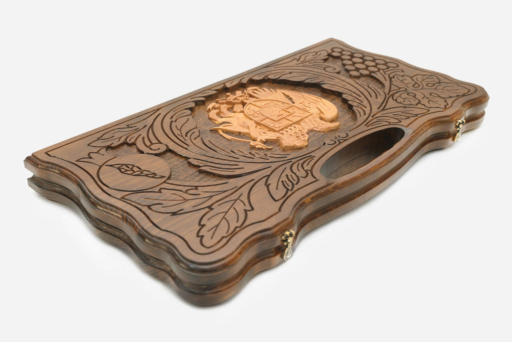 The backgammon board opened to show the wooden playing surface