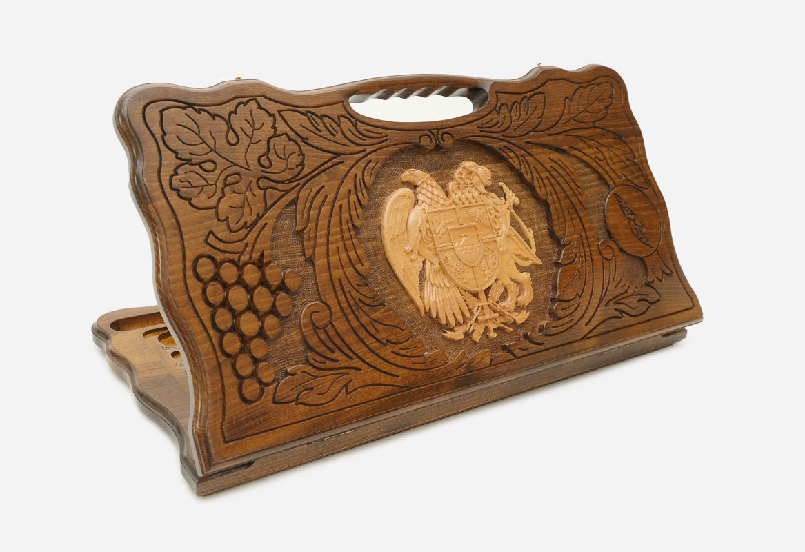 Carved beechwood backgammon board with the Armenian coat of arms and a carry handle, shown propped open