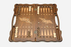 The backgammon board opened to show the wooden playing surface