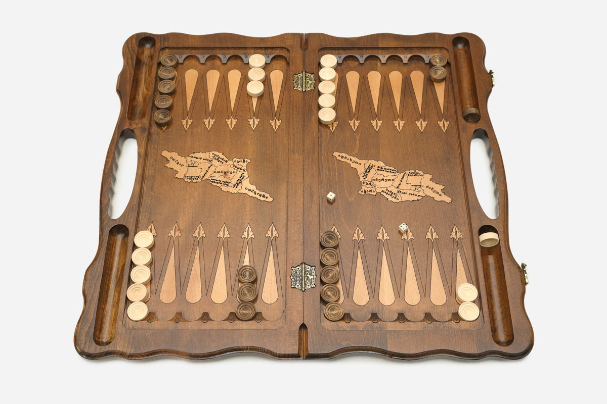 The backgammon board opened to show the wooden playing surface