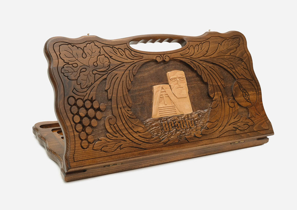 Carved beechwood backgammon board with the We Are Our Mountains monument of Artsakh and a carry handle, shown propped open