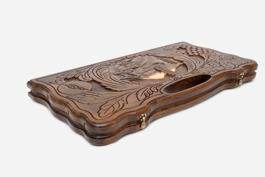 The backgammon board opened to show the wooden playing surface