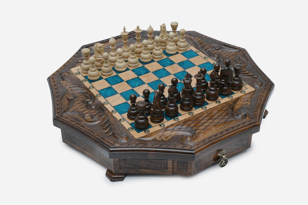 Angled view of the blue epoxy board framed by carved eagle corner reliefs