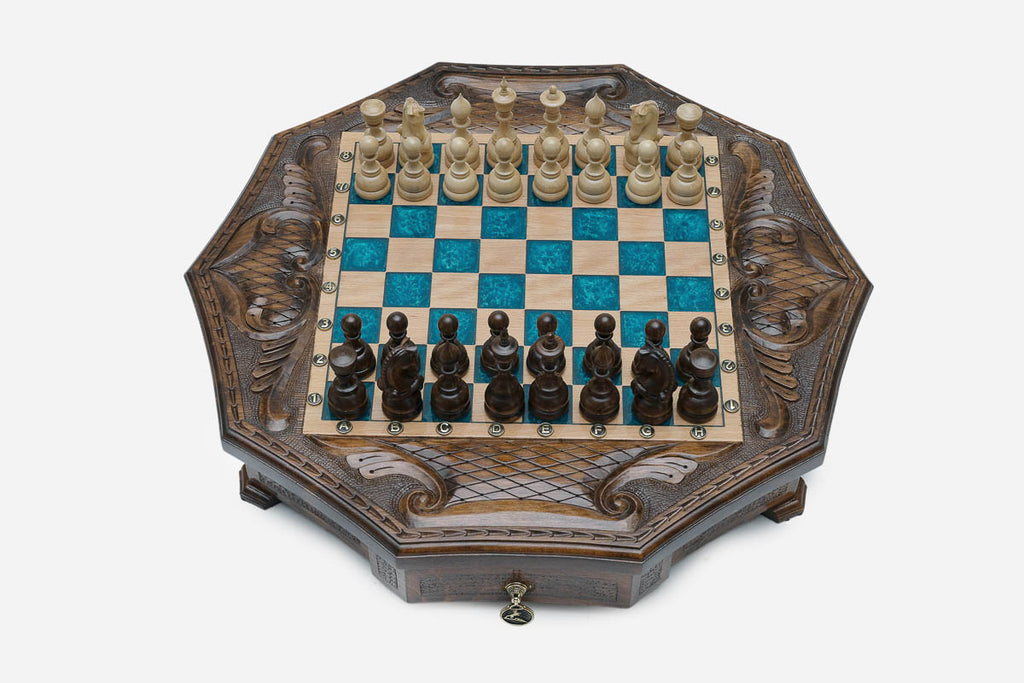 Full octagonal blue-epoxy chess board with light and dark wood pieces in starting position