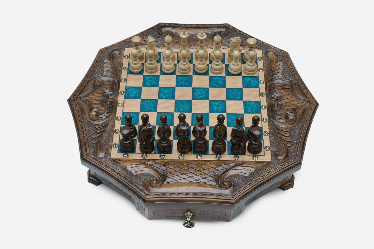Full octagonal blue-epoxy chess board with light and dark wood pieces in starting position