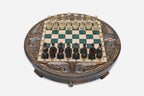 Round carved wooden chess set with emerald-green epoxy resin squares and wooden Staunton pieces arranged for play