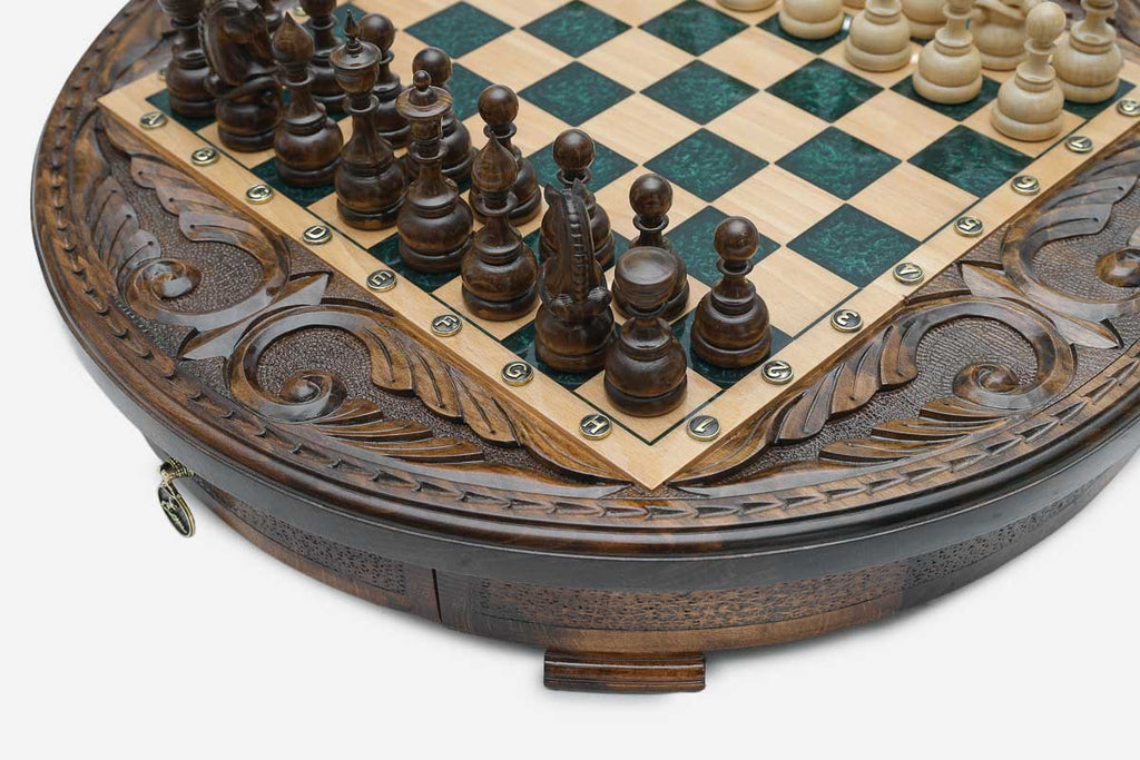 Detail of the carved acanthus-scroll frame around the green epoxy playing surface