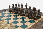 Close-up of the dark walnut chess pieces on the green epoxy board