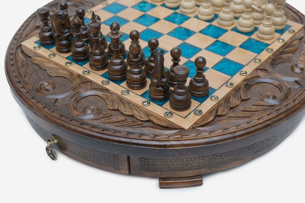 Close-up of the dark wood pieces and turquoise epoxy squares with the brass pendant drawer pull below