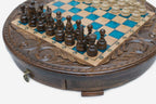 Close-up of the dark wood pieces and turquoise epoxy squares with the brass pendant drawer pull below