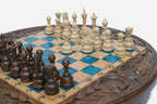 Detail of the carved acanthus-scroll frame surrounding the blue epoxy playing surface