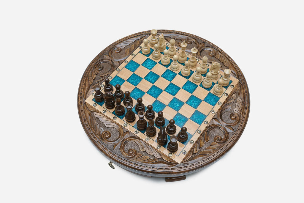 Top-down view of the blue epoxy chess board showing the glossy resin dark squares and maple light squares