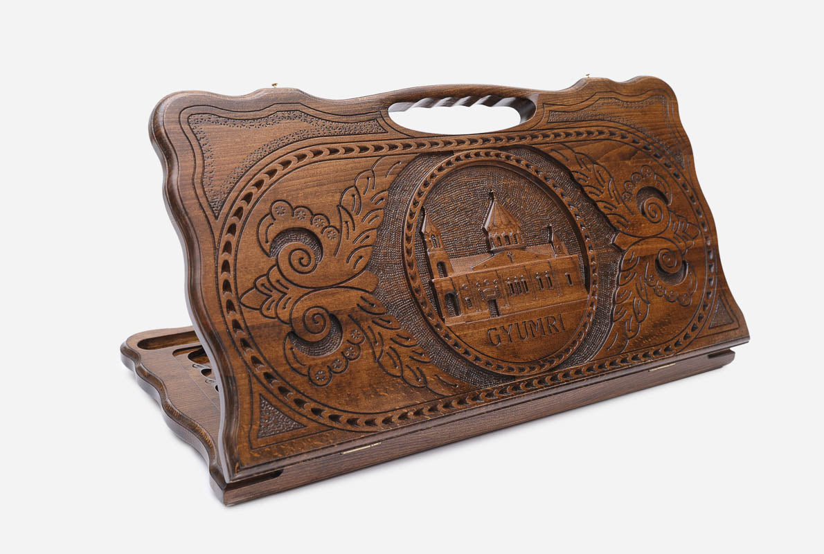 Carved beechwood backgammon board with the Holy Mother of God Cathedral medallion and a carry handle, shown propped open