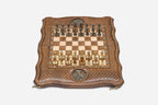 Top-down view of the Tree of Life chess set with gold and dark bronze figural soldier pieces arranged for play