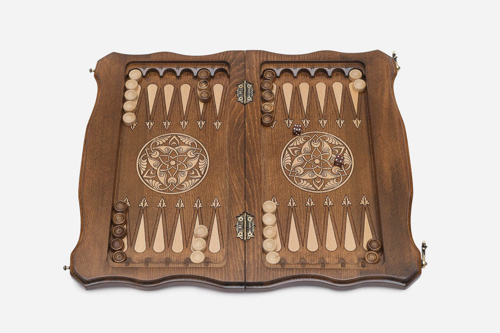 Open interior of the set showing the backgammon layout with wooden checkers and dice