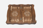 Open interior of the set showing the backgammon layout with wooden checkers and dice