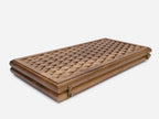 The board half-folded showing both engraved faces