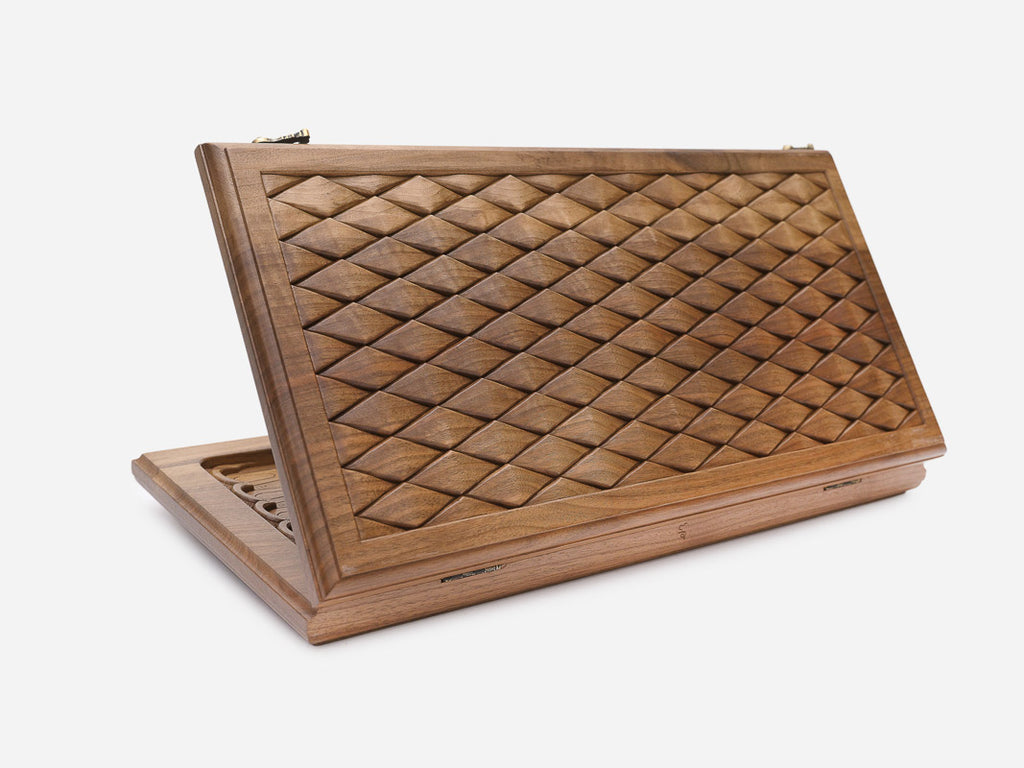 Folding walnut backgammon board with an all-over engraved diamond pattern, shown open