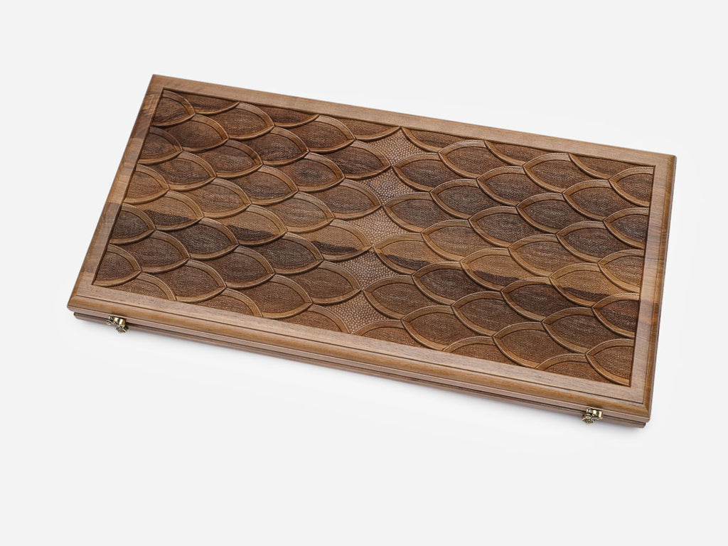 Close-up of the overlapping engraved scale pattern