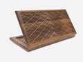 Folding walnut backgammon board with an all-over engraved fish-scale pattern, shown open