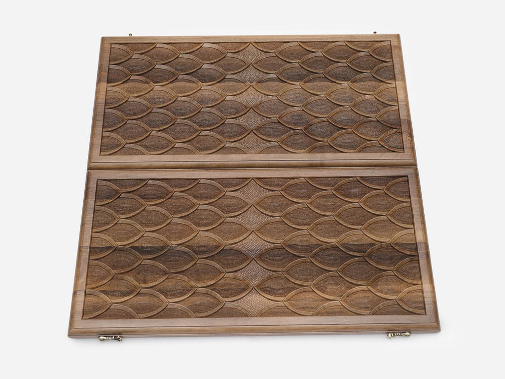 The board half-folded showing both engraved faces