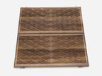 The board half-folded showing both engraved faces