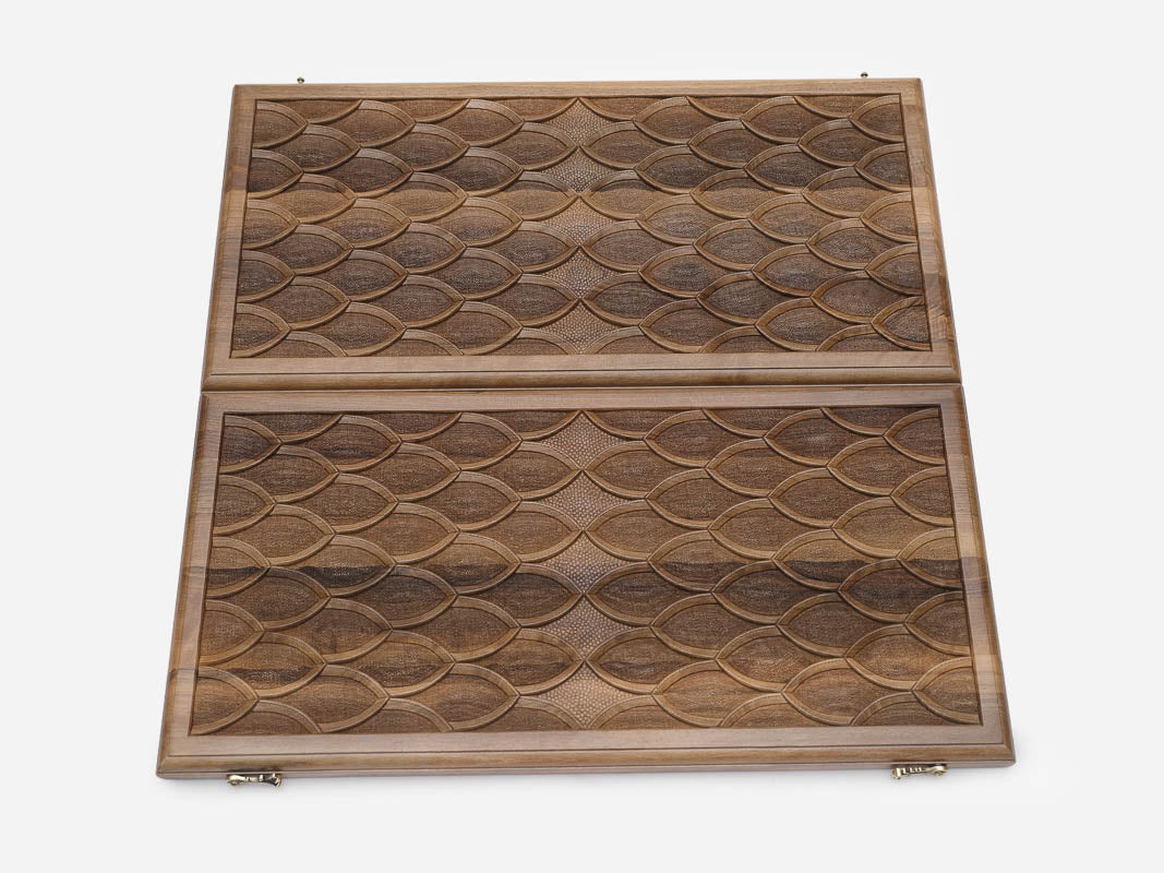 The board half-folded showing both engraved faces