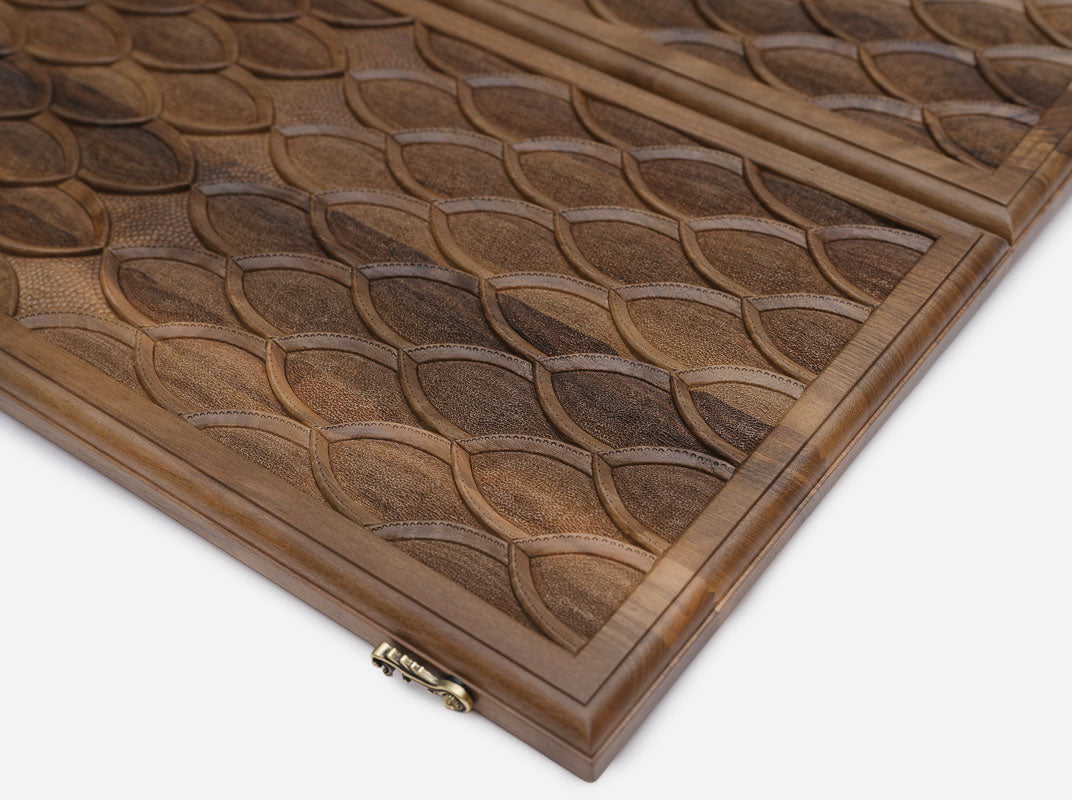 The backgammon board opened to show the wooden playing surface