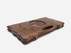 The backgammon board opened to show the wooden playing surface
