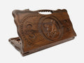 Carved beechwood backgammon board with a galloping horse medallion and a carry handle, shown propped open