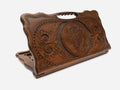 Carved beechwood backgammon board with a lynx medallion and a carry handle, shown propped open