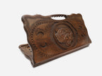 Carved beechwood backgammon board with a tiger head medallion and a carry handle, shown propped open