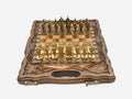 Walnut chess and backgammon set open to the chessboard with figural metal pieces