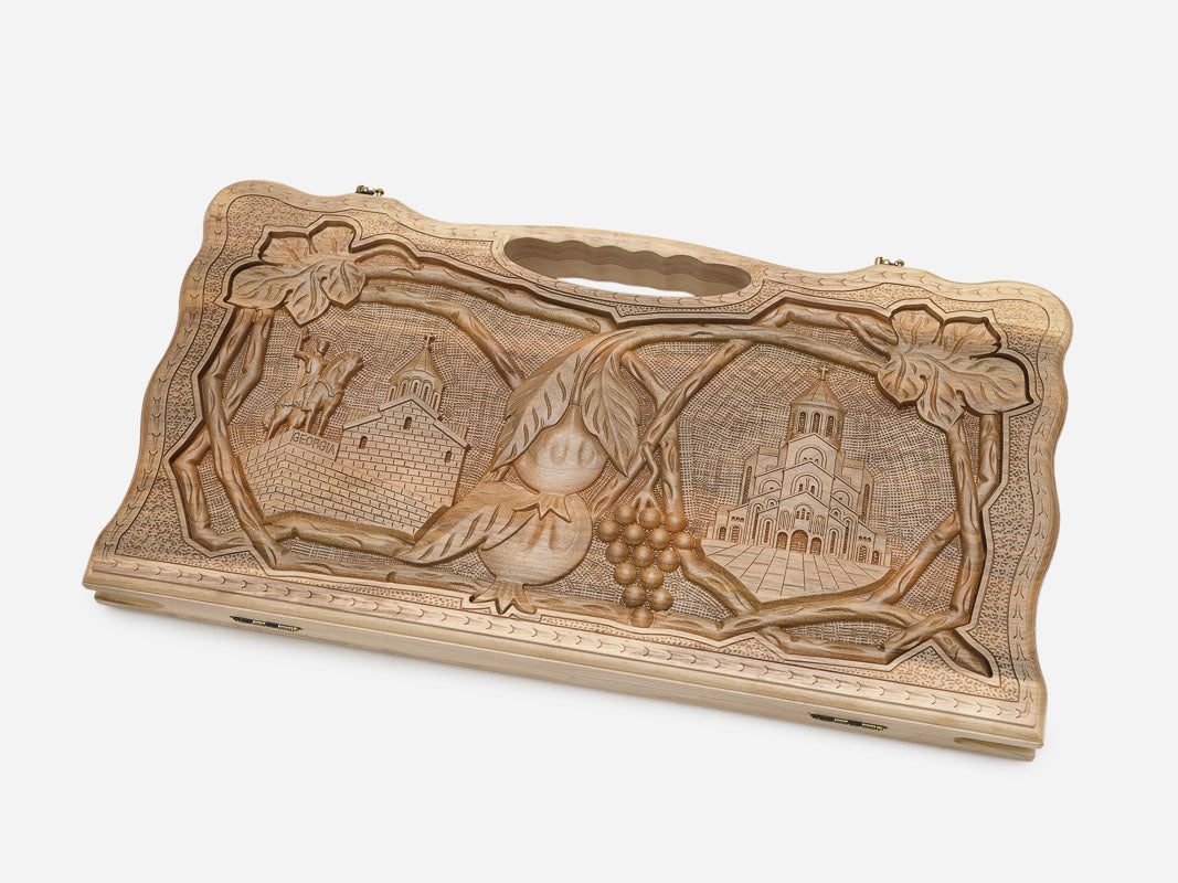 Angled view of the Georgian cross carved backgammon board