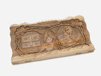 Close-up of the carved five-fold Georgian cross emblem